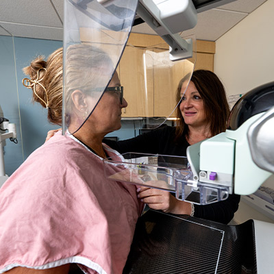 breast imaging technician with patient