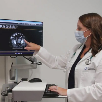gynecologic oncologist reviewing patient scan