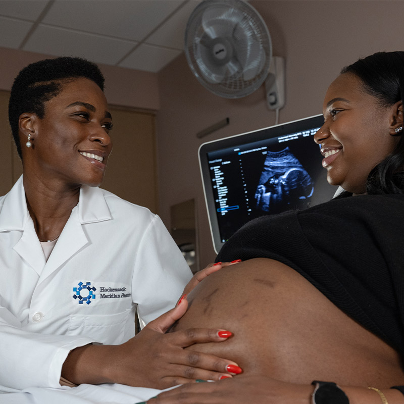 OBGYN doctor with a patient infront of an ultrasound