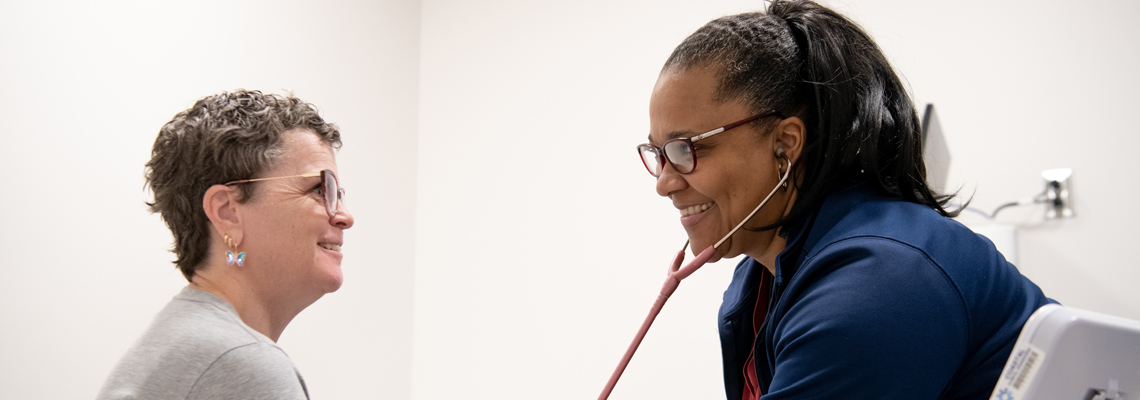Provider listening to patient's heart
