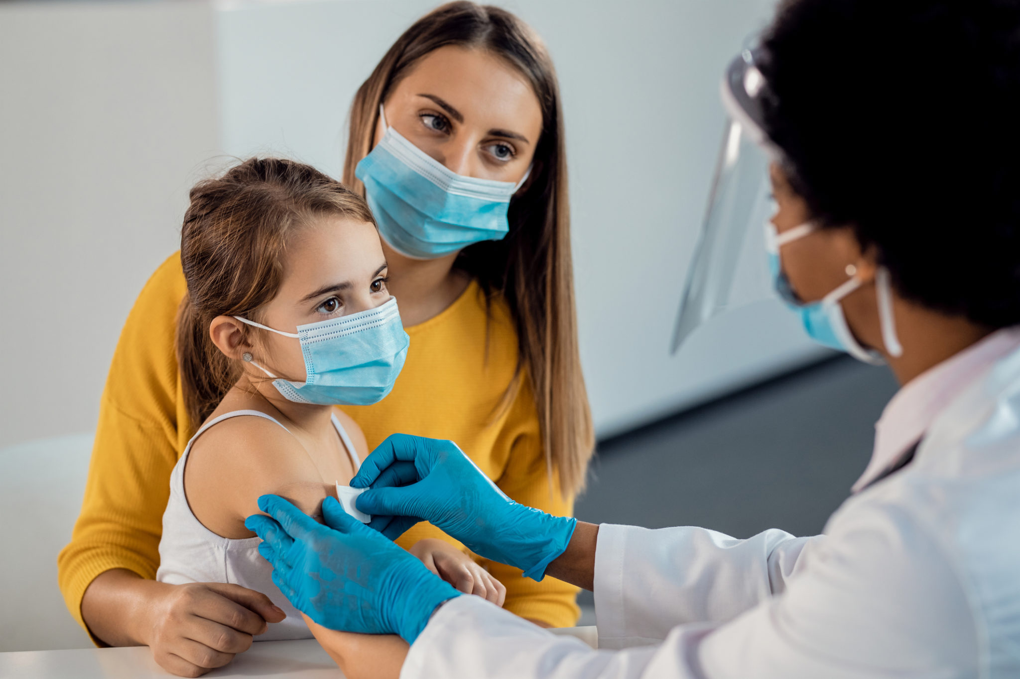 Young Girl with Parent Getting Vaccinated