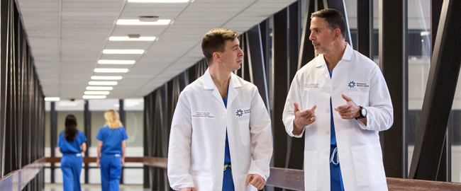 Heart care doctors walking in hospital