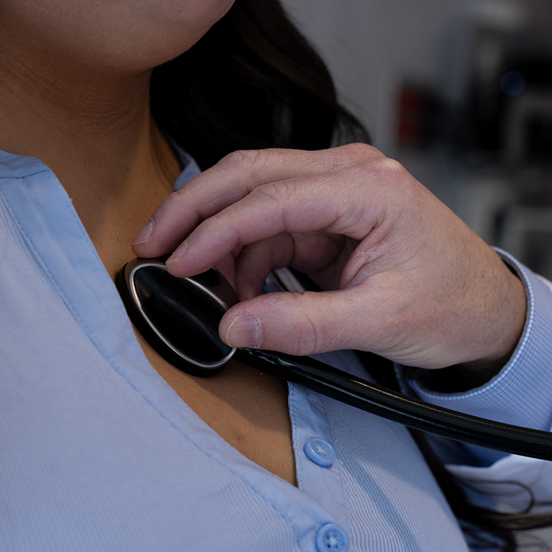 Doctor using a stethoscope on a patient’s chest