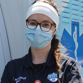 EMS professional with a mask on