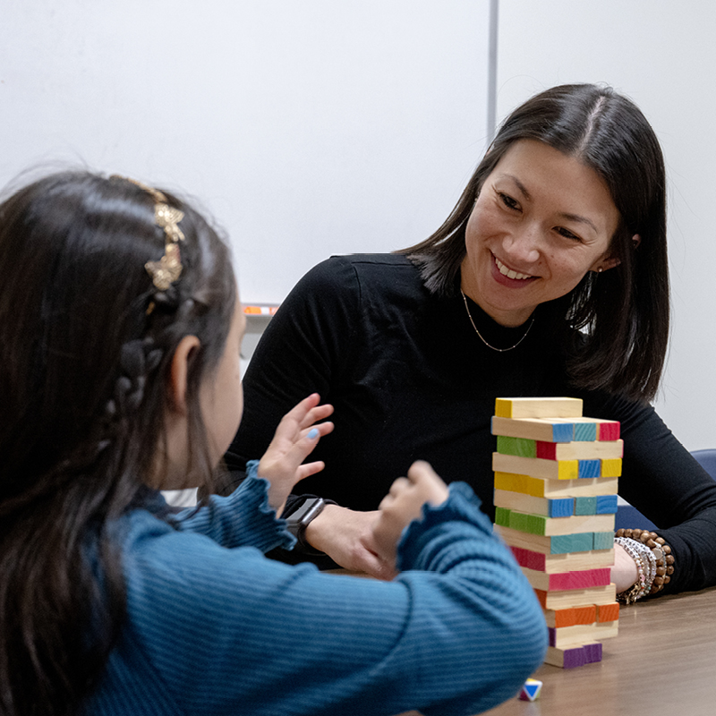 Woman and child playing blocks