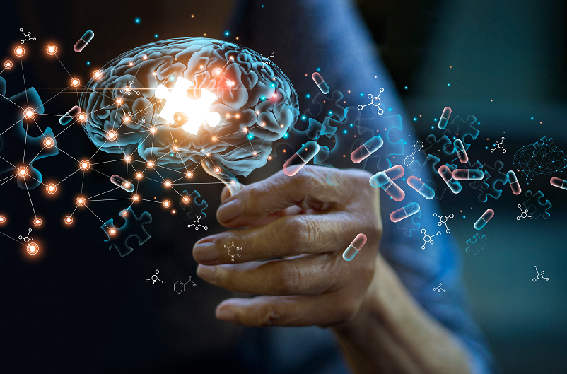 Parkinson's disease concept photo - a hand reaching out to represent a tremor, with a brain and medical symbols floating around. 