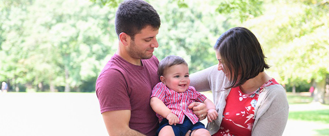 Michelle Price and her husband holding their baby