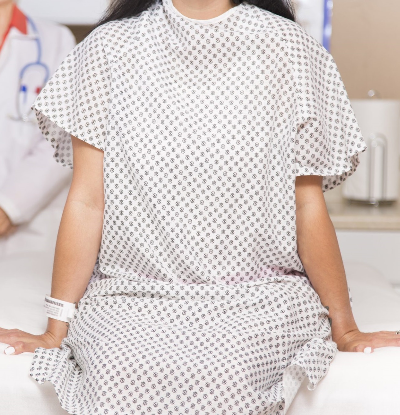 Woman in hospital gown