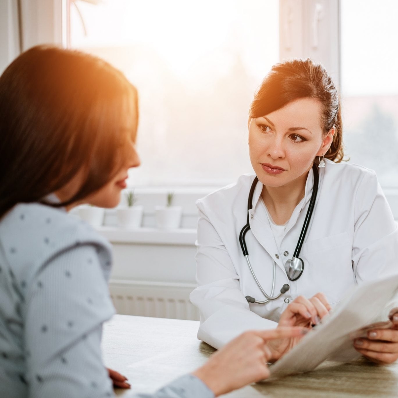 Doctor talking to her patients about breast cancer myths