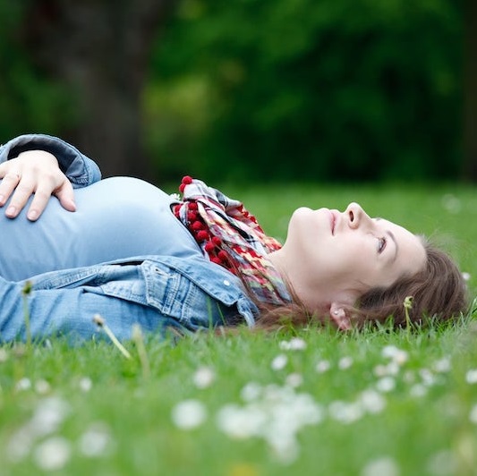 person laying in grass