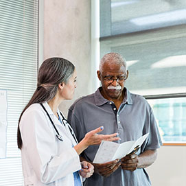 Man talking with female doctor