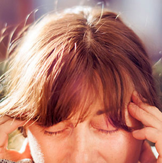 Woman with head pain