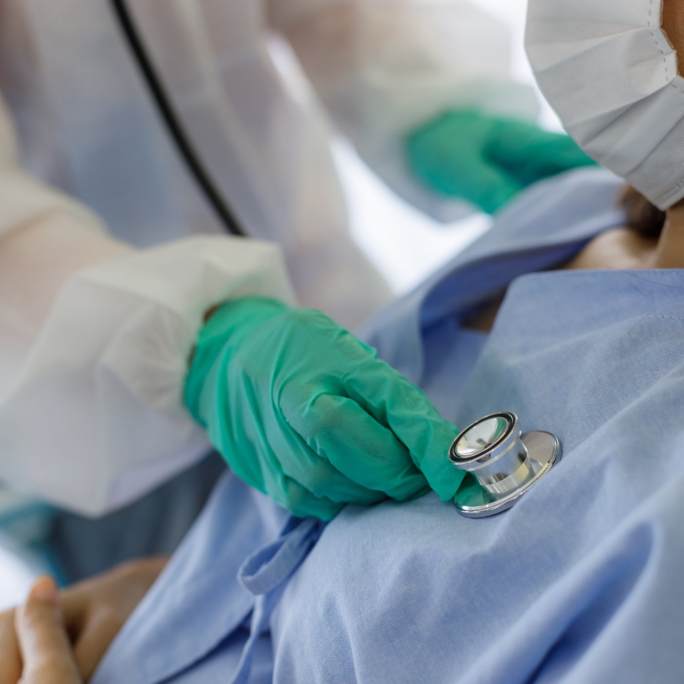 provider using a stethoscope on a patient