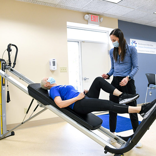 Therapist and patient working out