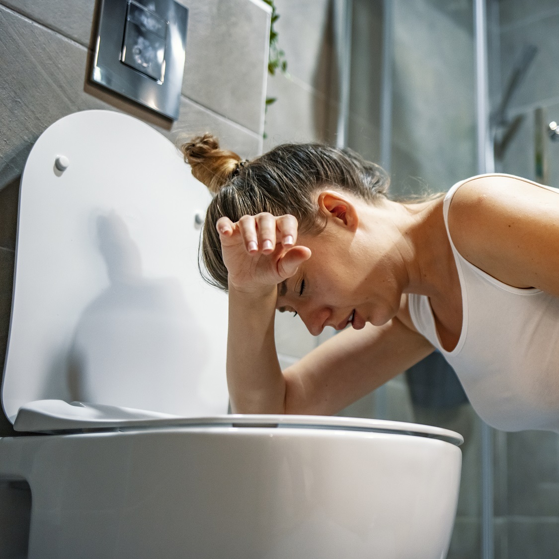 Woman with food poisoning image