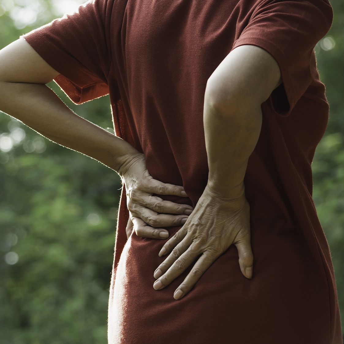 Woman holding lower back
