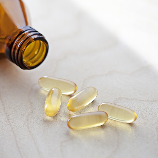 Vitamins spilled out on a counter, vitamin B12