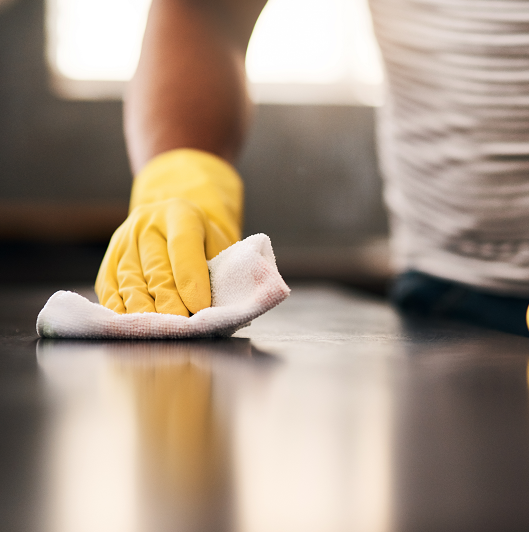 Close up of a counter being wiped down to clean off viruses, germs and monkeypox. 