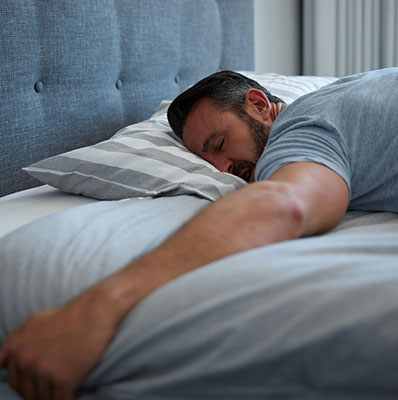 Middle aged man sleeping deeply. 