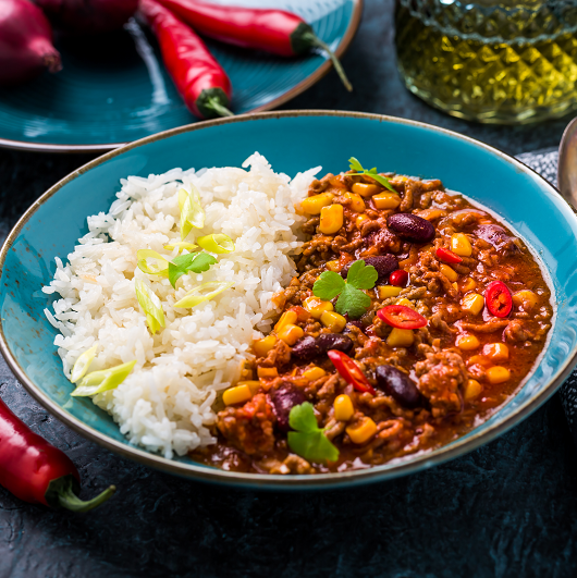 Stewed red kidney beans and rice in a bowl.