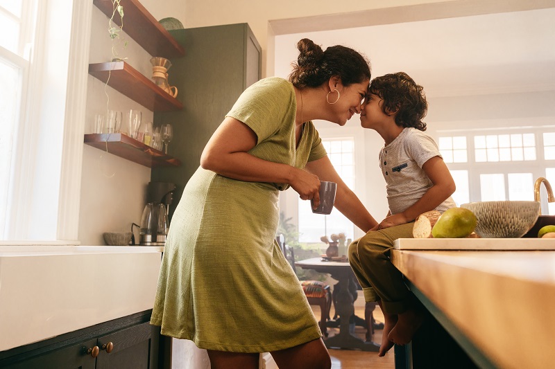 Mother and child in the kitchen bonding and connecting