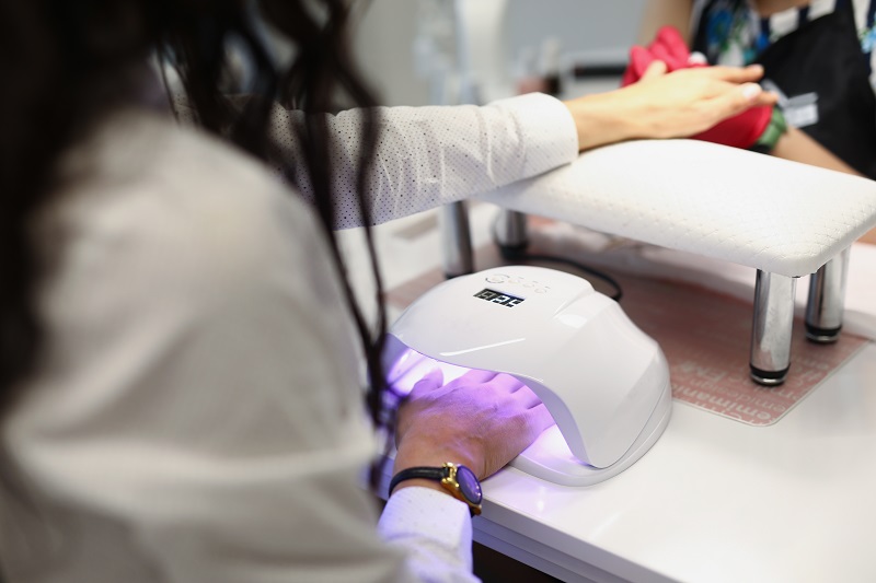 Woman getting her nails done with a gel manicure