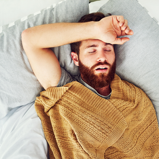 Man snoring and asleep, dealing with sleep apnea