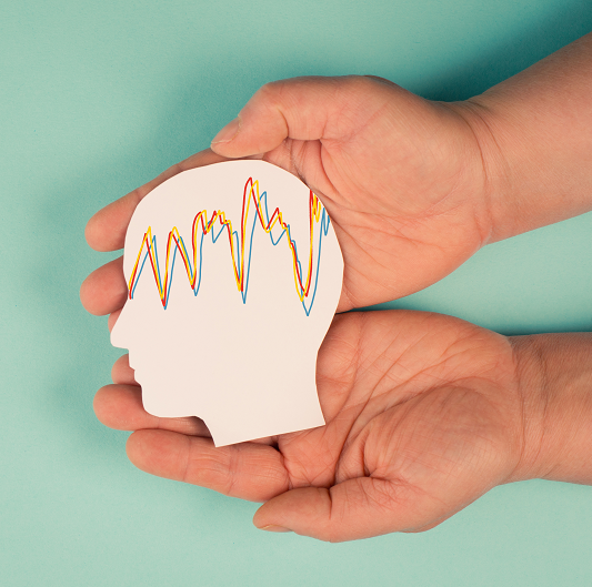 Holding a head in the hands, mental health concept for epilepsy, electrical current on head