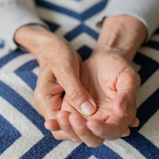 Close up of an elderly woman's hands, for Parkinson's tremor concept.
