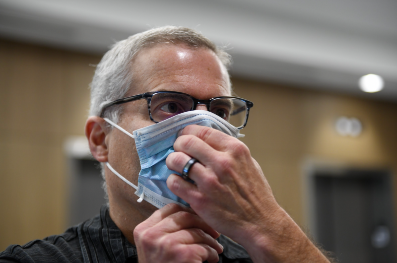 A man puts on a mask to protect himself from bird flu.