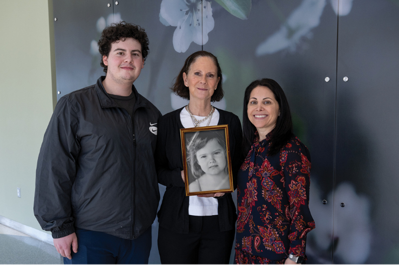 Kelly Lin Terry holds a framed photo of her daughter, Mya Lin.