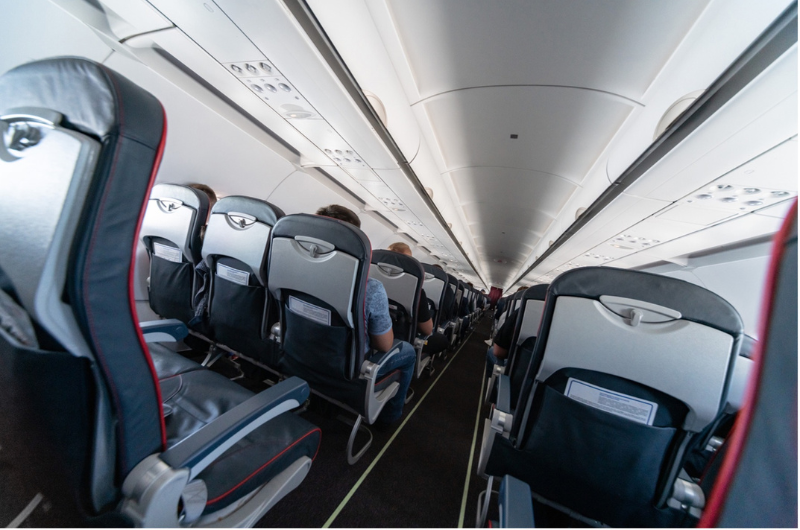 An interior shot of a commercial passenger airplane.