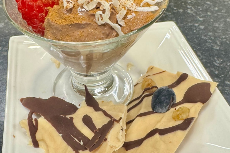 A top-down view of healthy frozen yogurt treats on a white plate.