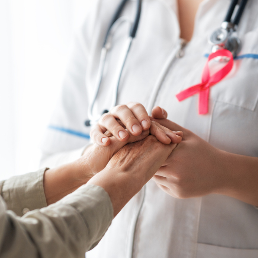 Doctor holding hands with patients