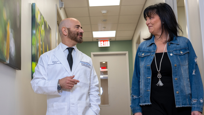 Doctor and patient walking in hallway