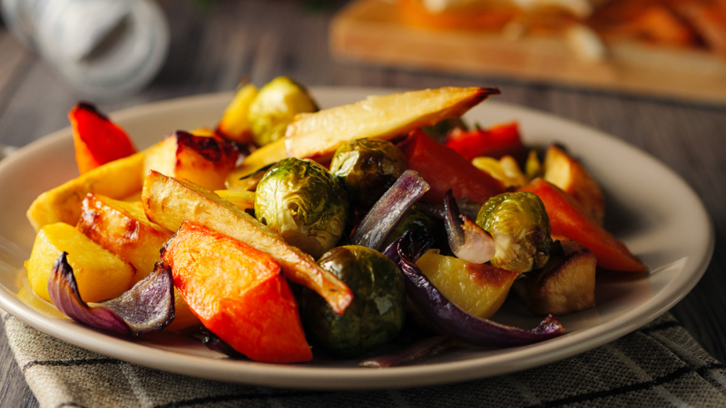 A plate of homemade, fresh honey-roasted root vegetables. 