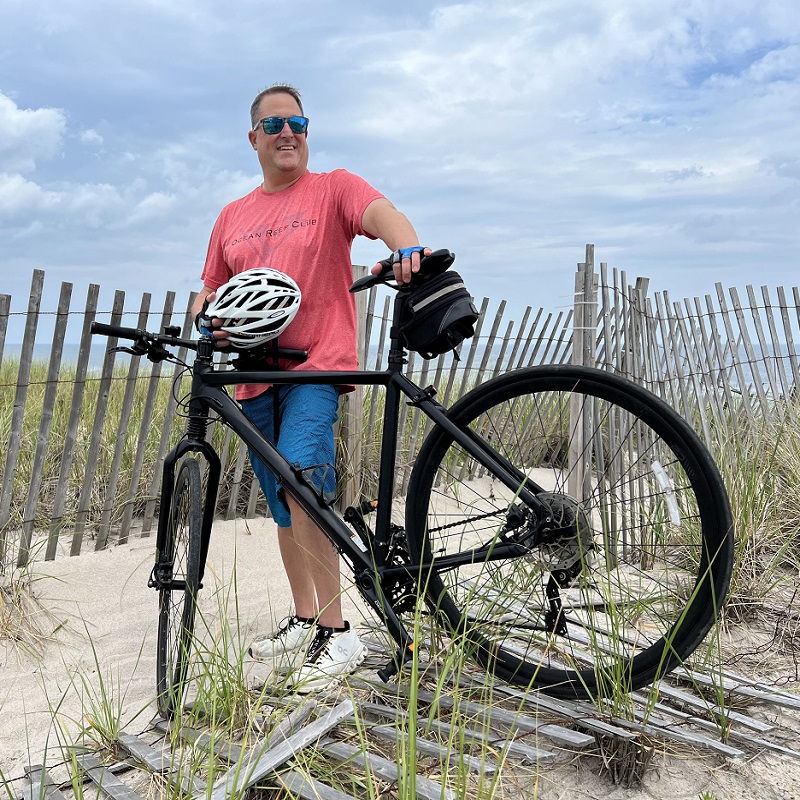 Anton Semprivivo with mountain bike on the beach