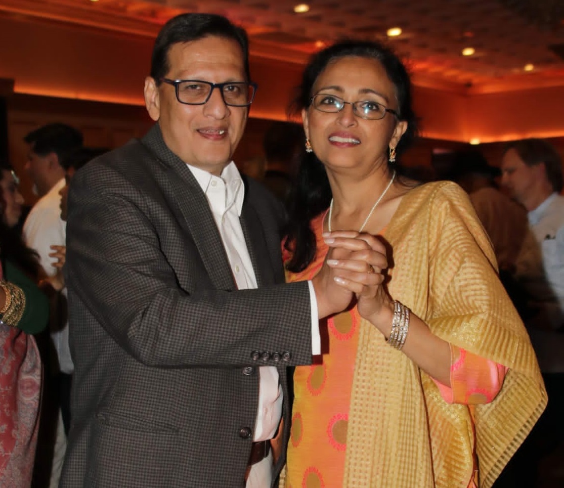 Patient, Kashyap “Kash” Saraiya, smiling and dancing with his wife Monica