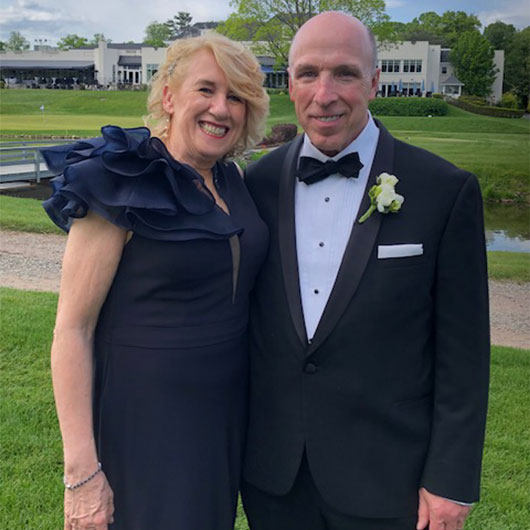 Tom Duffy smiling at a formal event.