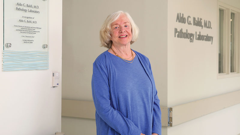 marilyn baldi standing smiling in hallway