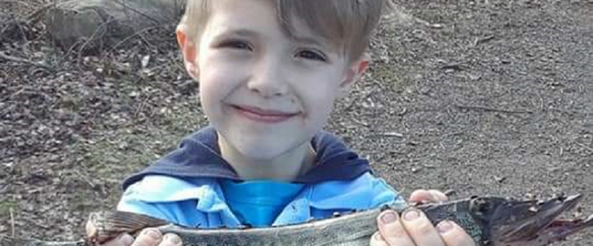 Aiden Downs holding a fish