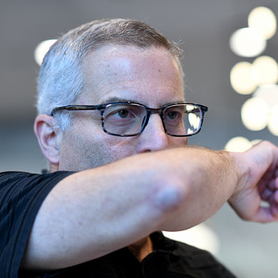 Man coughing into his elbow.