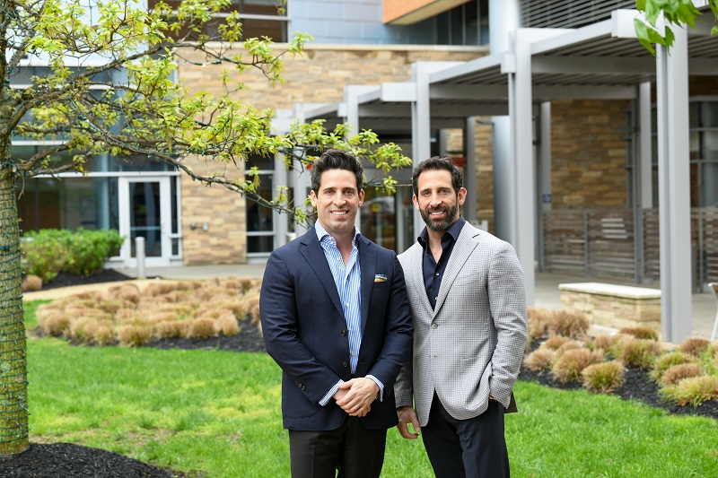 Twin brothers Lambros and Dimitrios Lambrou standing outside Ocean University Medical Center