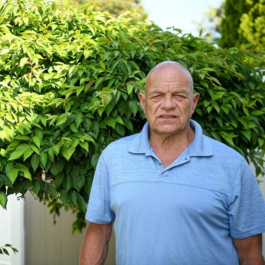  Patient James Roe standing outside 