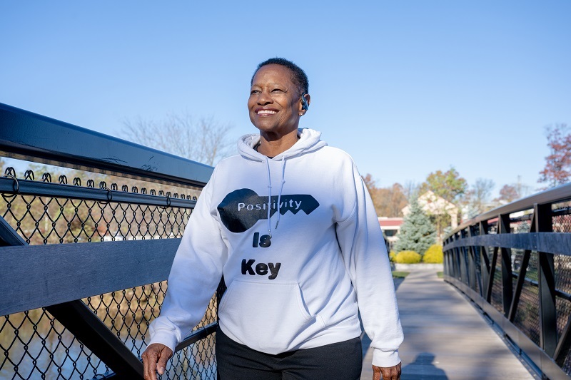 Evon Terrell smiling outside taking a walk.