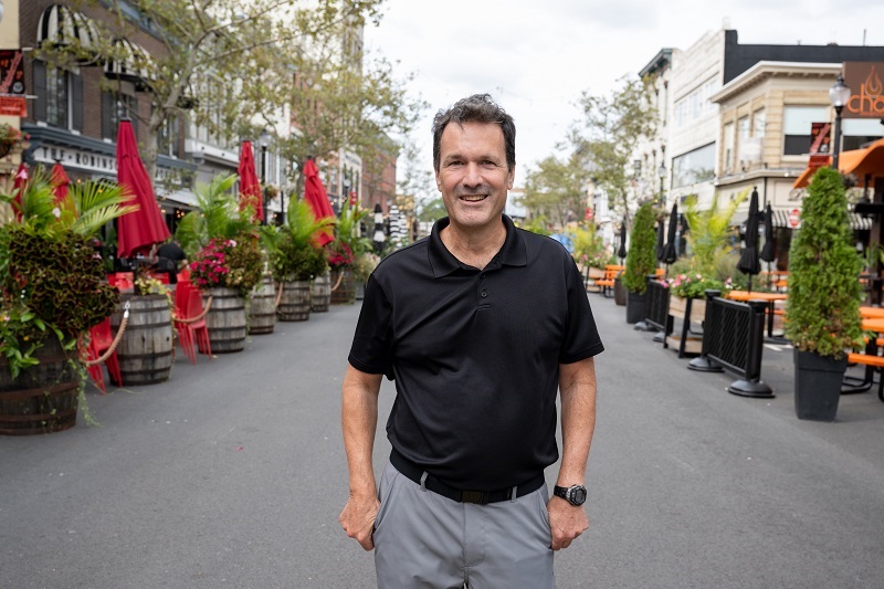Don Heintz standing in the street in Red Bank smiling.
