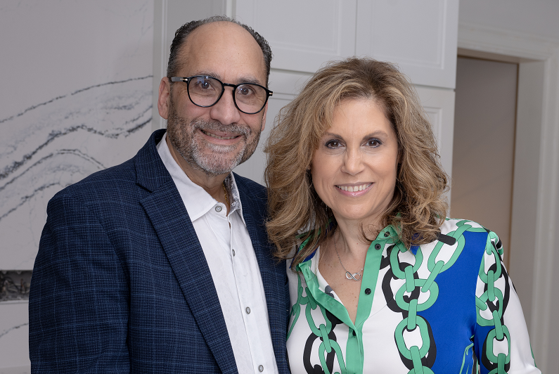 Kally Durso and her husband smiling.