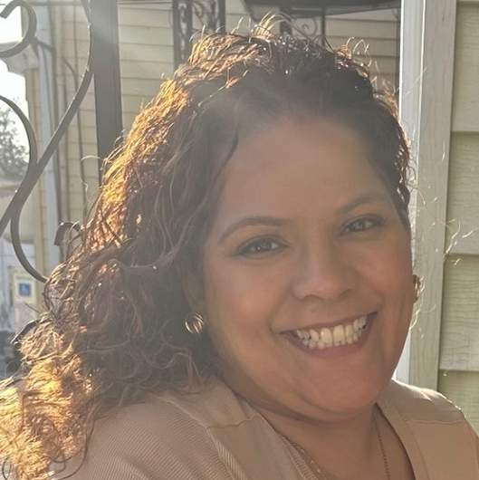 Crystal smiling on a front porch.