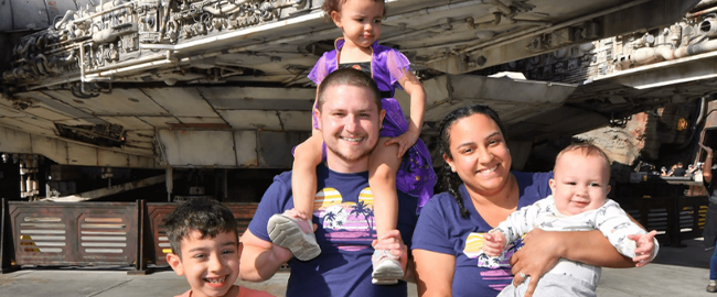 Imani Waldman holds her infant son next to her husband, daughter and older son.