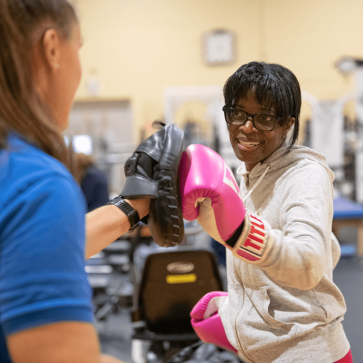 63-year-old Plainfield, New Jersey, woman Pat Dunstan boxes with a trainer.